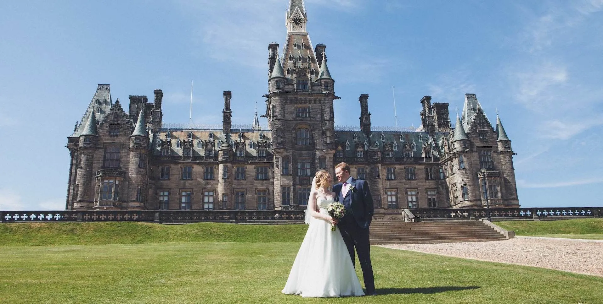 Wedding couple in front of Fettes College